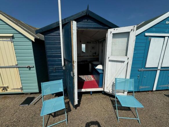 FRONT OF HUT