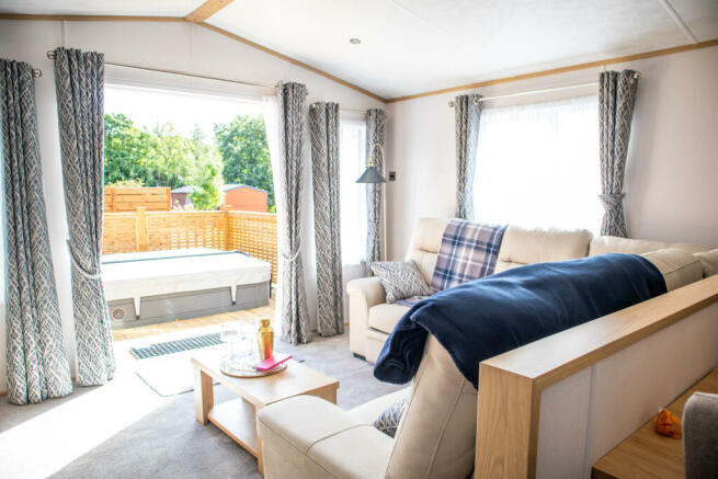 Living Room & Decking With Hot Tub