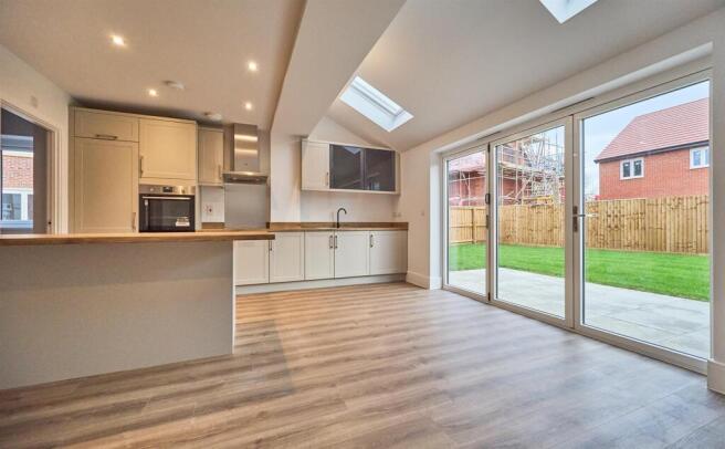 Open plan kitchen diner to rear
