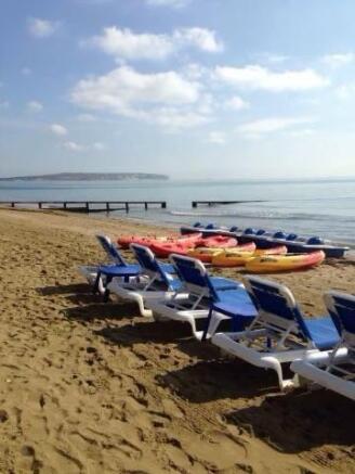 beach with kayaks and sunbeds.jpg