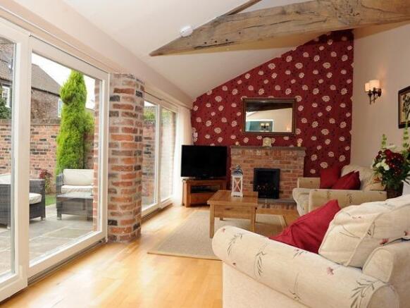 The Byre living room with patio.jpg
