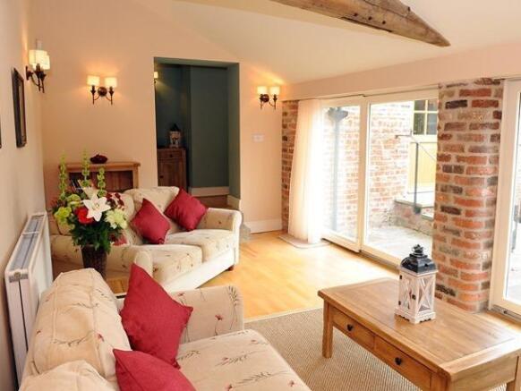 The Byre living room with patio 2.jpg