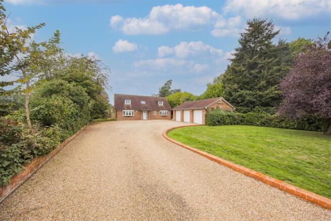Front Entrance & Triple Garage