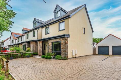 Detached four bedroom executive home, situated within the popular Court De Wyke development, on the edge of Claverham