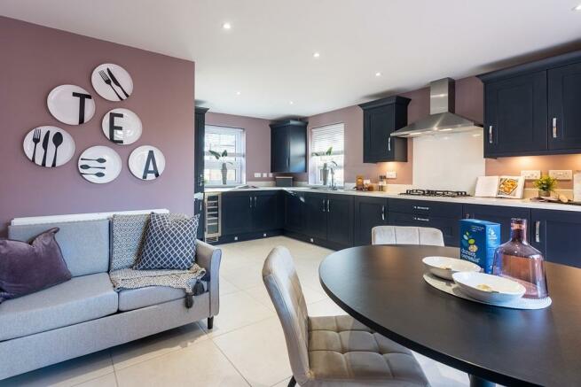 Open-plan kitchen diner with family seating space and french doors onto your rear garden