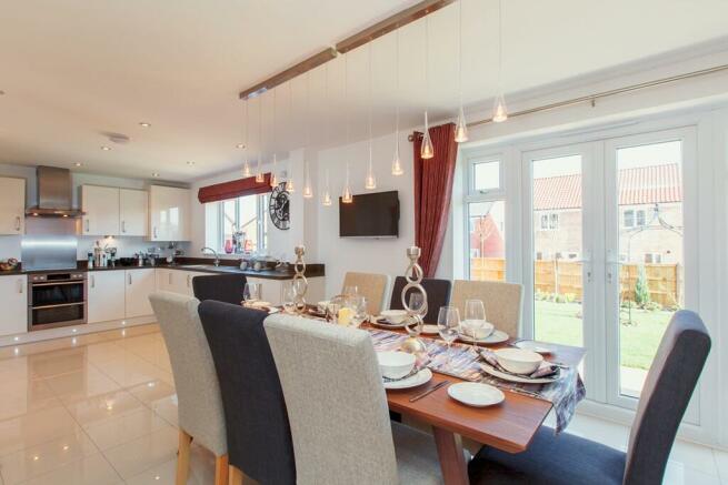 The open plan kitchen/dining area is the hub of this family home