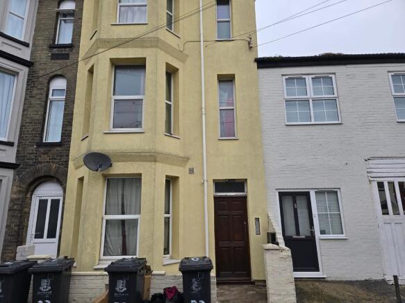 Front of building - flat is top window