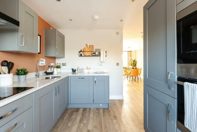 The bright and airy kitchen is at the front of the home