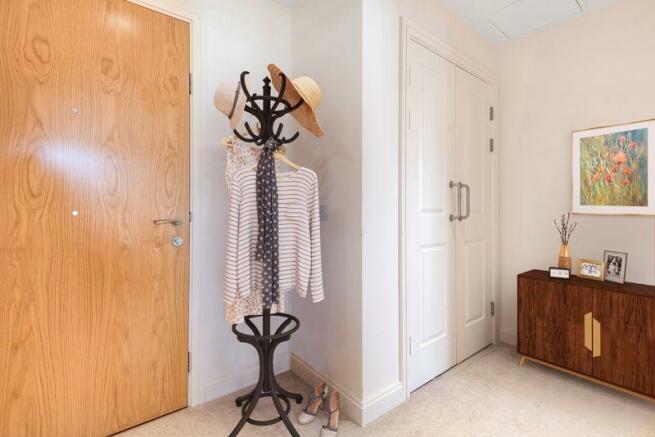 Hallway with storage cupboard