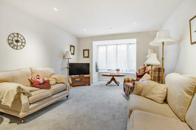 Living/dining room with bay window