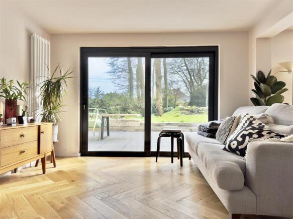 LIVING ROOM DOORS TO REAR PATIO.jpeg