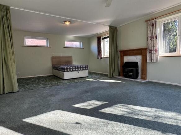 LIVING ROOM/BEDROOM FOUR: