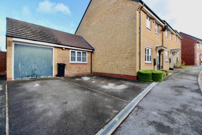 Garage and driveway directly in front of the garag