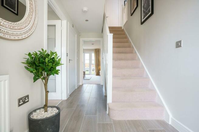 The central hallway with under stairs storage