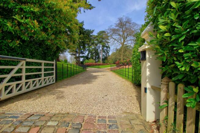 Gated driveway and landscaped grounds