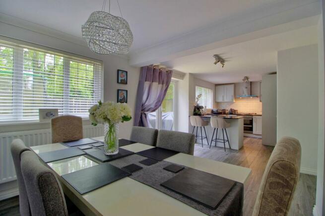 Kitchen opens to living room with double doors