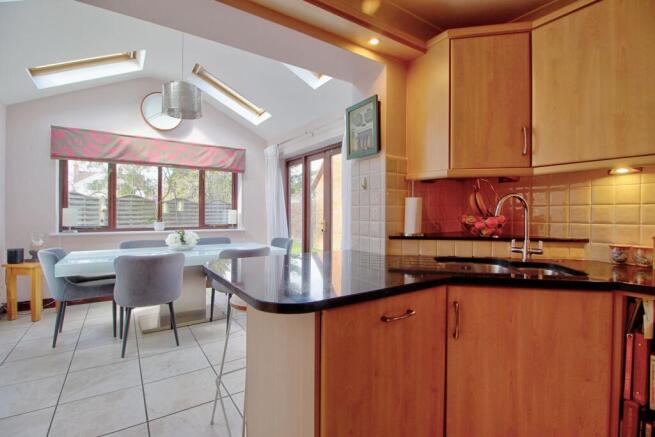 Open-plan kitchen with breakfast bar