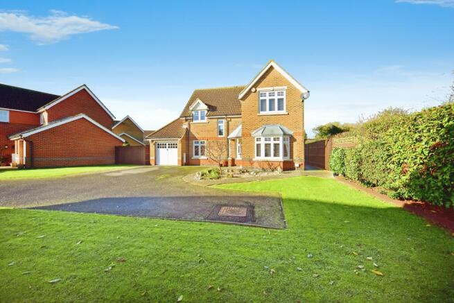 Outside View Of The Property With Driveway Parking