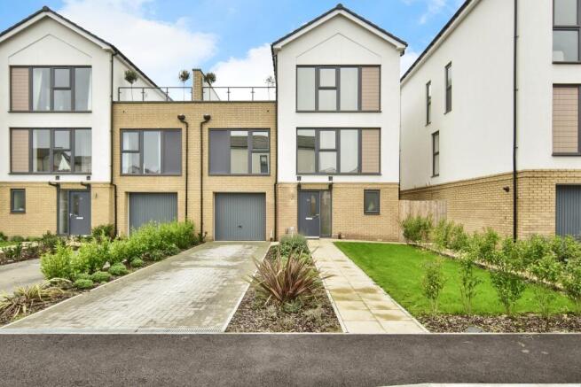 Outside View Of The Property With Driveway Parking