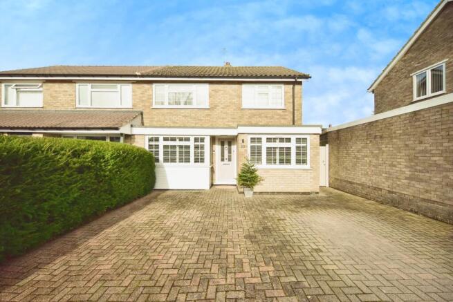 Outside View Of The Property With Driveway Parking