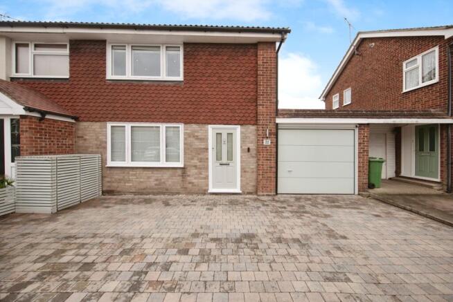 Outside View Of The Property With Driveway Parking