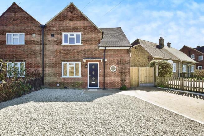 Outside View Of The Property With Driveway Parking