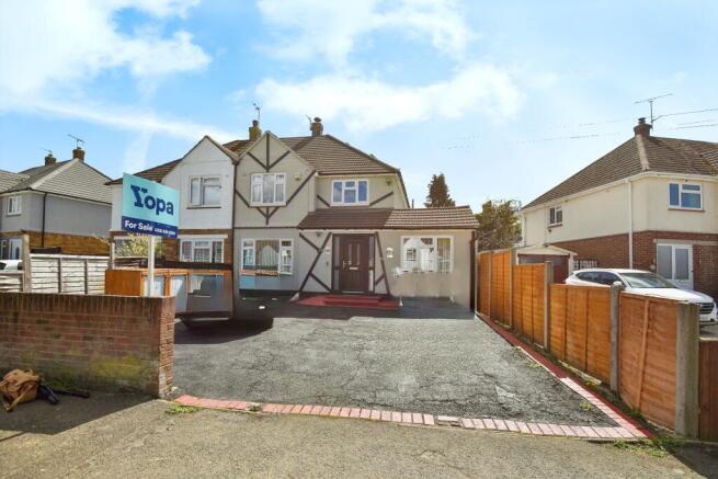 Outside View Of The Property With Driveway Parking
