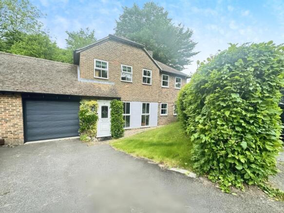 Outside View Of The Property With Driveway Parking