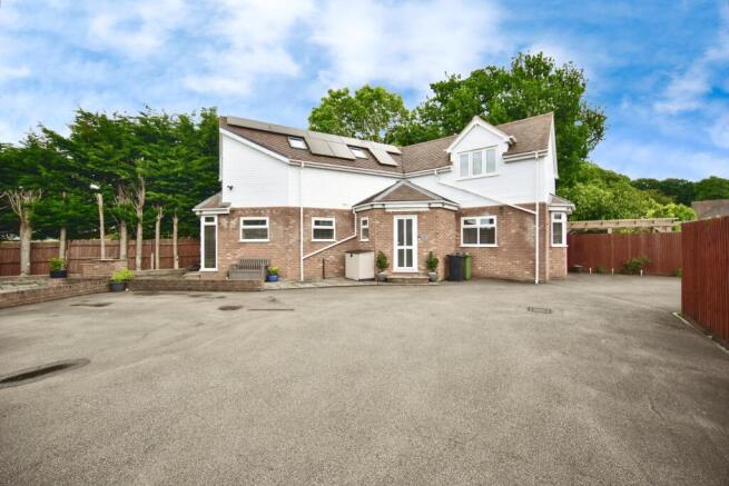 Outside View Of The Property With Driveway Parking