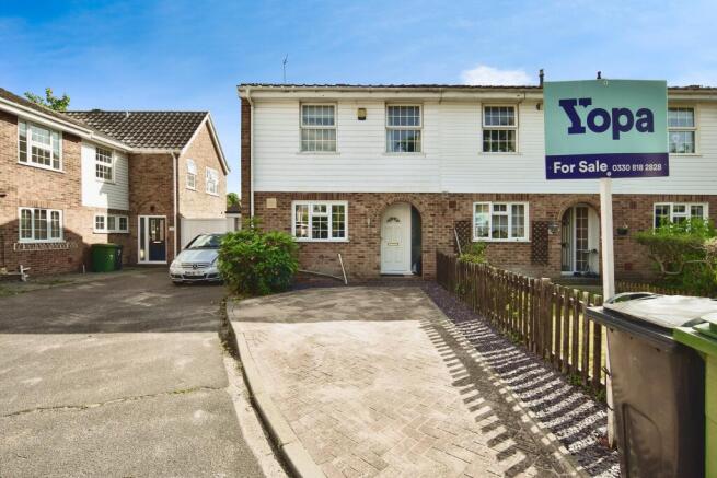 Outside View Of The Property With Driveway Parking