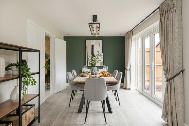 The dining area features French doors which open out to the garden