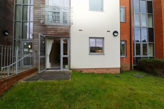 Door From Lounge/Dining Room to Communal Grounds