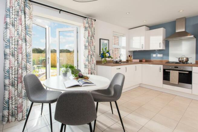 Internal view of Archford kitchen with French doors to garden