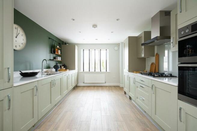 The galley kitchen has ample storage and worktop space