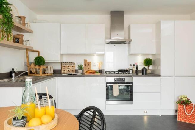 The open plan kitchen has plenty of space for cooking and food prepartion