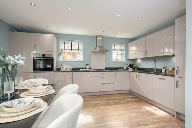 Inside view of the Alderney open plan kitchen. 4 bed home.