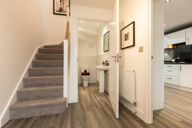 The welcoming entrance hallway with a guest cloakroom