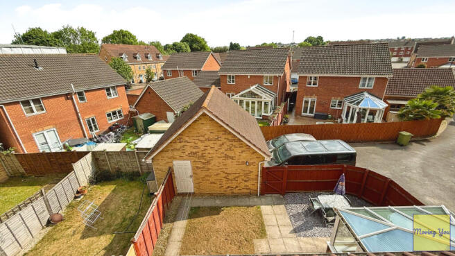 View of garage & garden