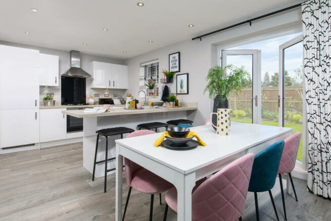 Inside view 4 bedroom Chester dining area with French doors to garden