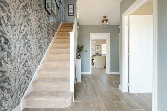 A light and inviting hallway welcomes you to the Rushton