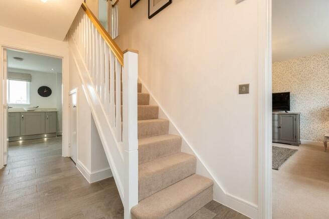 The central staircase allows for easy access to all rooms