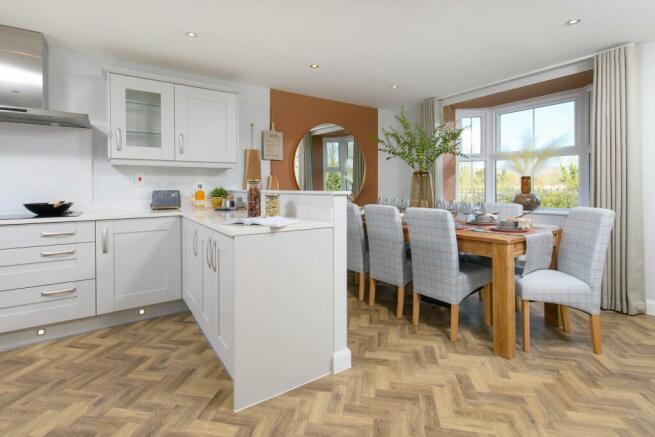 Open-plan kitchen & bay-fronted dining area in Avondale style home