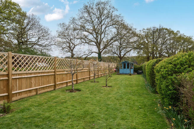 100ft South facing rear garden with private gate leading directly onto the adjacent recreation ground