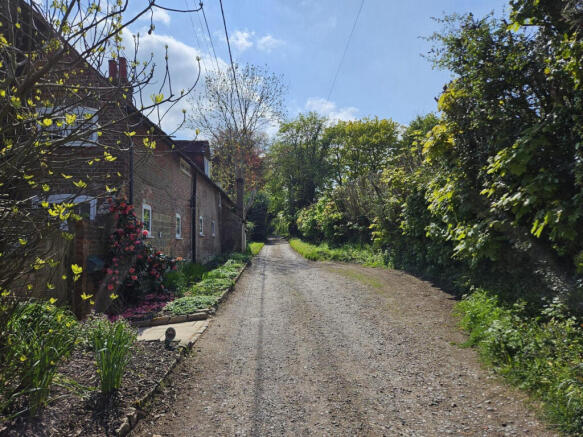 The house and school lane which is a quiet no through country lane with direct access to Ashdown Forest