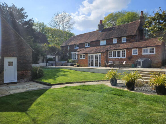 Rear elevation, terrace and detached guest accommodation