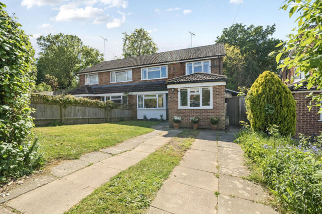 Front elevation, front garden and driveway providing parking for two vehicles
