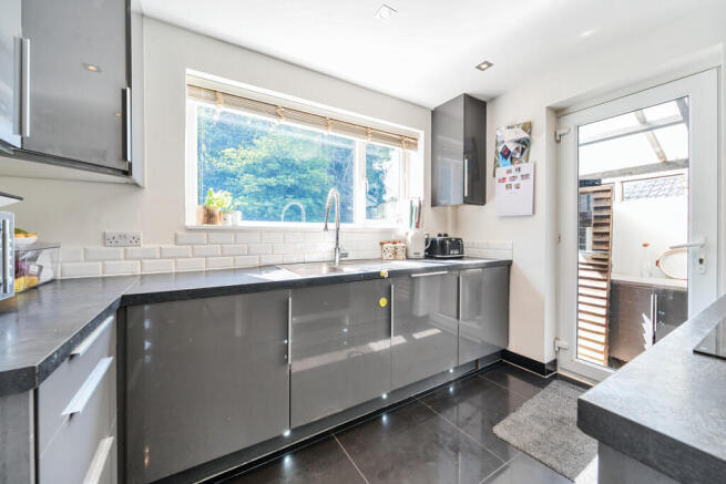 Kitchen with door out to covered utility room