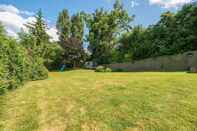 Large private rear garden with views over open woodland and fields