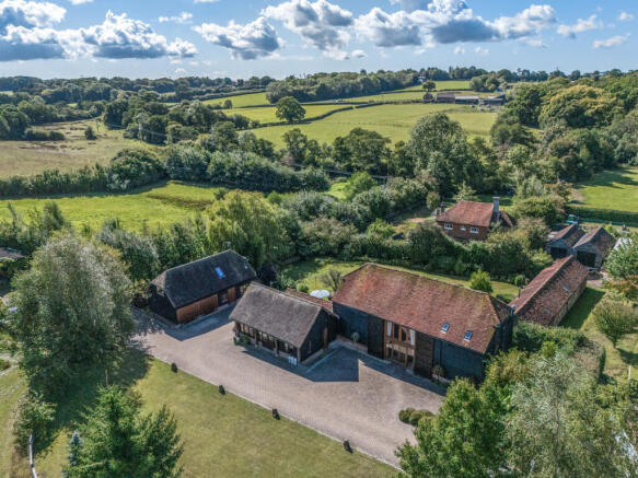 Elevated view over the property and outbuildings