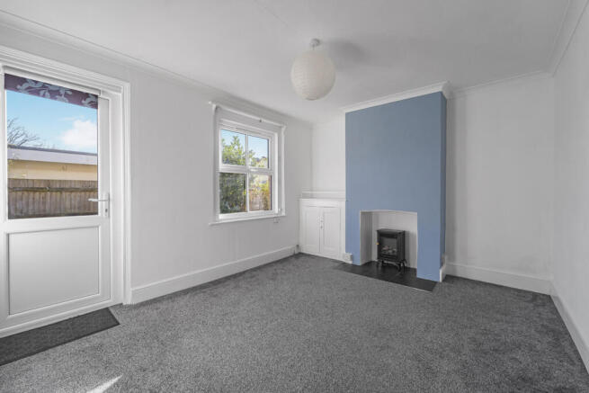 Living room with access onto the rear terrace